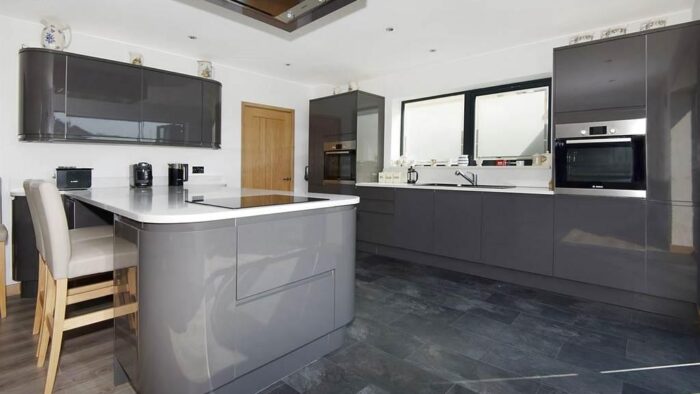 Large Howdens Gloss Hanldeless Kitchen and Utility Room