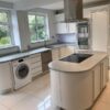 Modern White Matt Satin Rounded Kitchen designed by Marazzi Kitchens