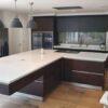 Kulhmann wood Kitchen with huge Island & Corian Worktops