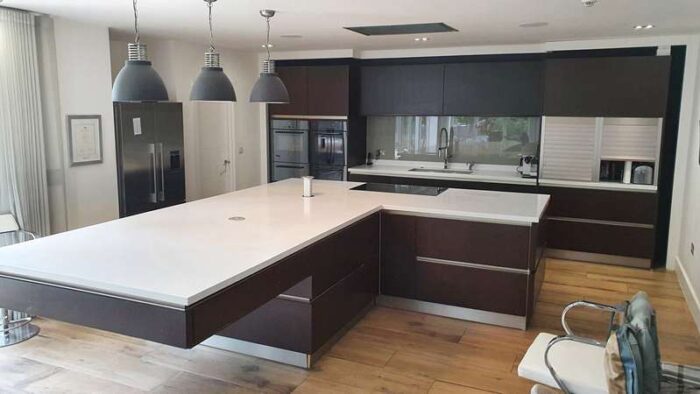 Kulhmann wood Kitchen with huge Island & Corian Worktops