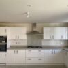 As new Gloss White Kitchen with Laminate Worktops & Appliances