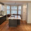 Poggenpohl Cream & Wood Veneer Kitchen + Stone Worktops & Miele & Gaggenau Appliances