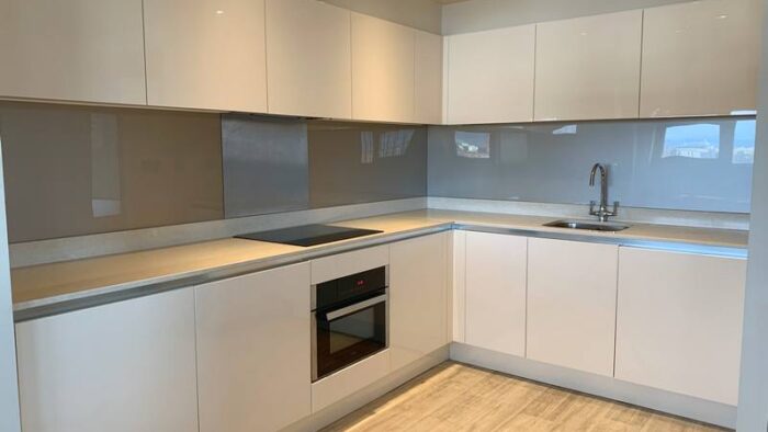 Gloss Buttercream Kitchen with Stone Worktops & Appliances - 3831516