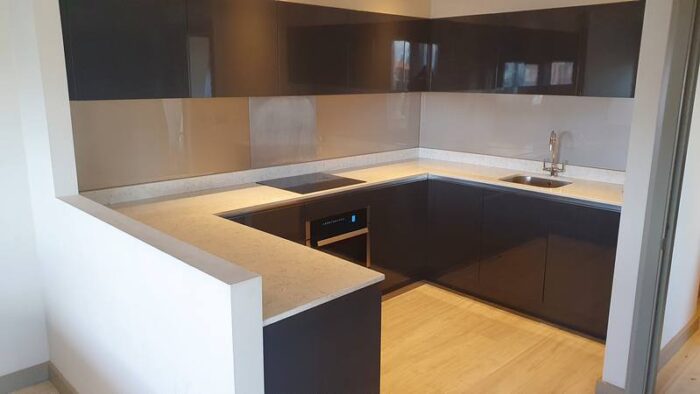 Modern Gloss Dark Grey Kitchen with Stone Worktops & Appliances