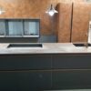 Ex Display Nolte Handleless Flair Matt Black & Copper Kitchen with Dekton Worktops