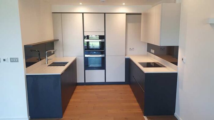 SieMatic Dark Wood Black & Matt Grey Kitchen, Grey Corian with Miele Appliances