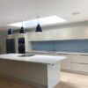 Gloss Cream Modern Handleless Kitchen with Quartz & Miele Appliances