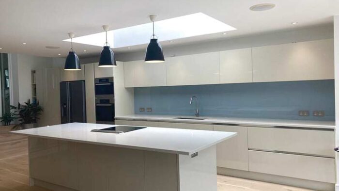 Gloss Cream Modern Handleless Kitchen with Quartz & Miele Appliances