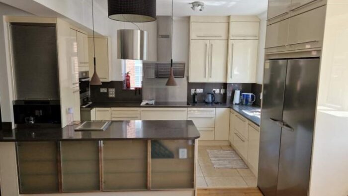 Cream Gloss Kitchen, Granite Worktop & Miele Appliances