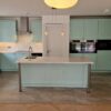 Wood Shaker Light Teal Kitchen with Quartz & Miele