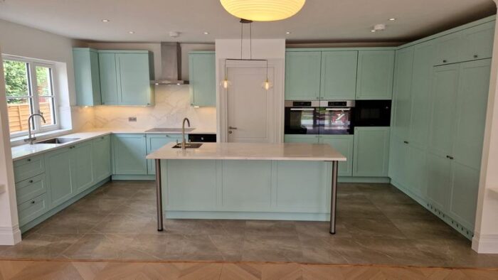 Wood Shaker Light Teal Kitchen with Quartz & Miele