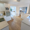 Bespoke-Modern-Large-Light-Grey-Grained-Gloss-Kitchen-Utility-Area-Bosch-Appliances-Quartz-Worktops