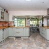 Howdens Sage Green Matt Shaker Kitchen AEG Lamona Appliances Wood Worktops