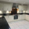 Symphony Buttercream Gloss Kitchen AEG Appliances Granite Worktops