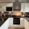 White Gloss Modern J Handle Neff Appliances Black Granite Worktops