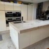 Siematic Buttercream Gloss Channel Handle Kitchen & Island Miele Gaggenau Appliances Limestone Worktop