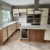 William Ball Modern ButterCream Gloss Wood Trim Kitchen & Island Neff - Baumatic - Hoover Appliances Corian Worktops