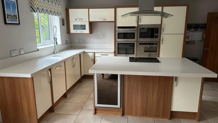 William Ball Modern ButterCream Gloss Wood Trim Kitchen & Island Neff - Baumatic - Hoover Appliances Corian Worktops