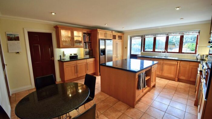 Large Wood Door Pilaster Kitchen & Matching Utility Room Neff Maytag Bosch Appliances Black Granite Worktops