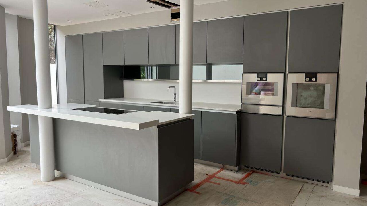 Poggenpohl Gaggenau Modern Grey Handleless Kitchen & Island Gaggenau Liebherr Siemens Quooker Appliances Corian Worktops