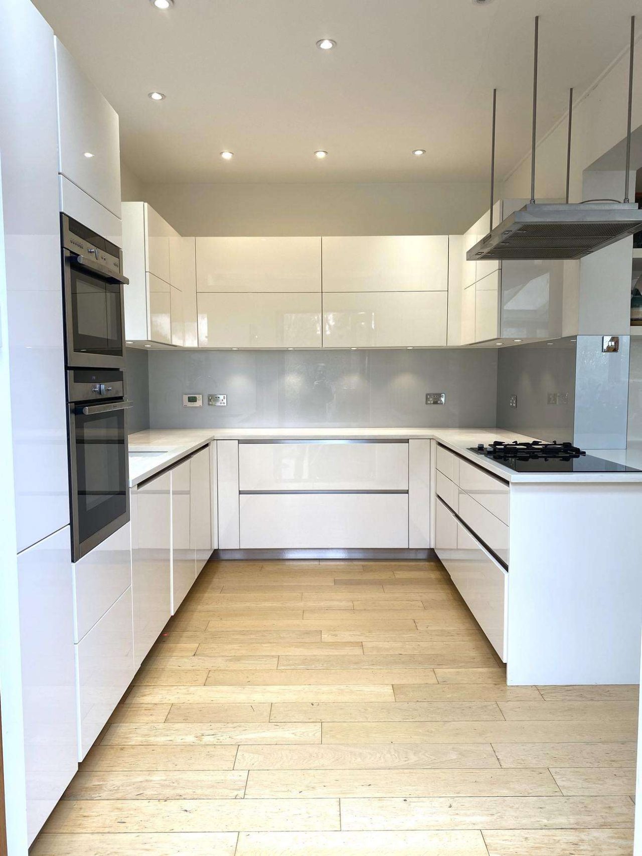 Schmidt Modern White Gloss Handless Neff Airforce Appliances Nearly Blanco White Quartz Worktops