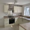 Roundell Alabaster Slab Door Kitchen & matching Utility Room Electrolux Appliances Light Oak Laminate Worktops