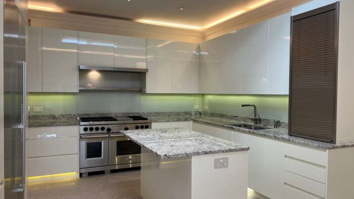 Mowlem & Co White Gloss + Stone Textured Handleless Kitchen & Island