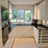 Howdens White Gloss Modern Kitchen & Utility Room – Bosch Appliances – Black Quartz Worktops