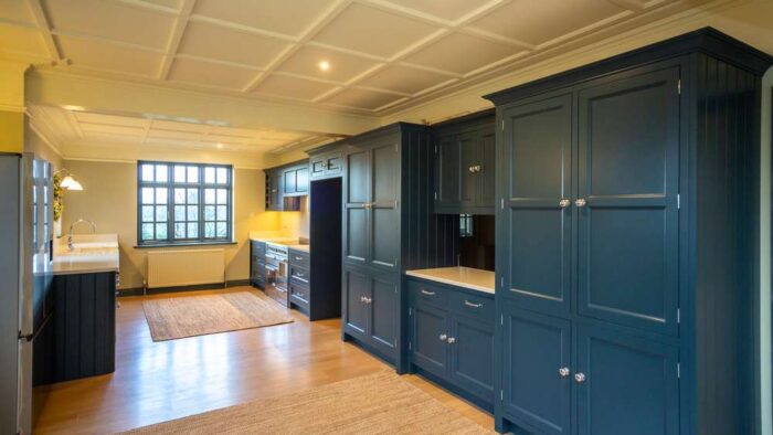 Modern Bespoke Handcrafted In Frame Blue Galley Kitchen – White Granite Worktops – Butler Sink & Mixer Tap