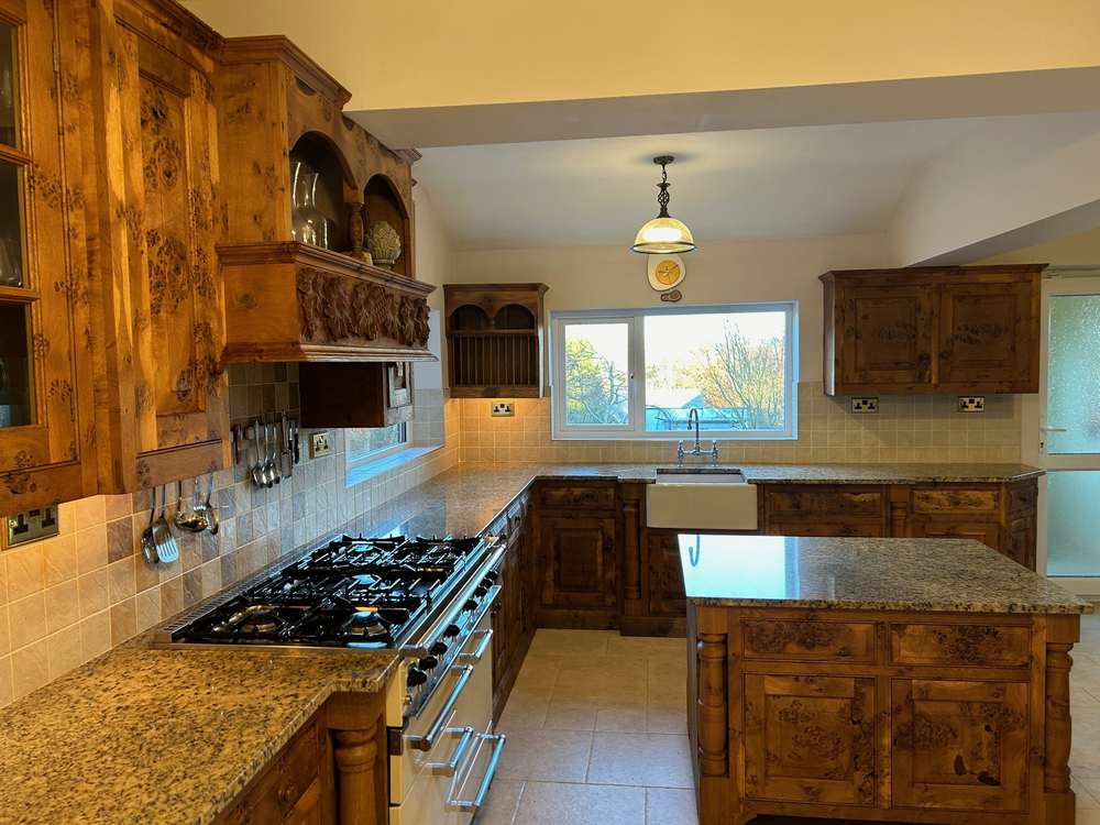 https://usedkitchenhub.com/wp-content/uploads/2023/12/Original-Pippy-Oak-Pilaster-Character-Traditional-Kitchen-Feature-Detailed-Wood-Engraving-Island-%E2%80%93-Falcon-Hotpoint-Appliances-%E2%80%93-Granite-Worktops-00002.jpg