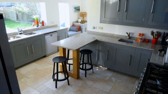 Harvey Jones Light Grey Oak Shaker Kitchen - Maytag Miele Appliances – Granite Off White with Grey Fleck Worktops