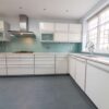 Modern Alno Buttercream Gloss - Grey Trim Border Kitchen – Bosch Siemens Neff Appliances – Granite Worktops