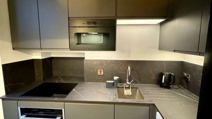 Modern Bespoke Dark Grey Compact Kitchen – Neff Samsung Appliances – Grey & White Veined Worktops