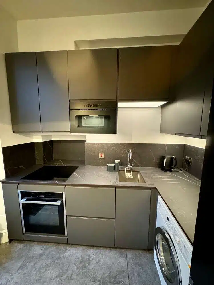 Modern Bespoke Dark Grey Compact Kitchen – Neff Samsung Appliances – Grey & White Veined Worktops