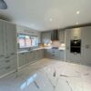 Symphony Modern Fresh Light Grey Shaker - White Framed Kitchen – AEG Zanussi Appliances - White Silestone Worktops