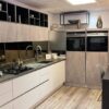 Ex Display Hacker Classic Handleless Laser Soft Taupe & Putty Concrete Pearl Grey Kitchen and Wooden Peninsular – Siemens Miro Appliances – Cosentino Dekton Trillium Worktops