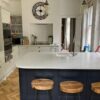 Fresh Dove Grey Howdens Kitchen with Navy-Blue Peninsula – Smeg Neff AEG Appliances - Quartz Worktops