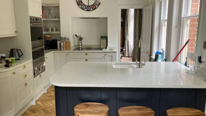 Fresh Dove Grey Howdens Kitchen with Navy-Blue Peninsula – Smeg Neff AEG Appliances - Quartz Worktops