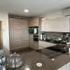 Modern Light Beech & Kashmir Gloss Kitchen & Peninsular – Miele Appliances