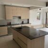 Oak Effect Handleless Kitchen with Island – Miele Neff Quooker Appliances – Granite Worktops