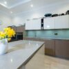 Handleless Modern Wood Grain effect - Light Buttercream Gloss Kitchen & Large Island – Siemens Appliances – Quartz Worktops