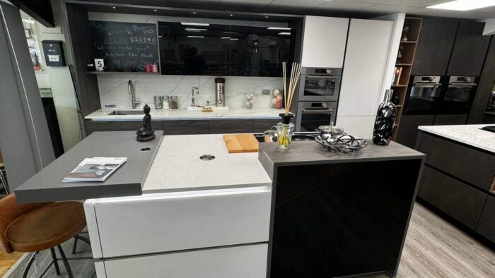 Ex-Display-Hacker-Systemat-Dark-Pine-Effect-Kitchen-with-Island-–-Quooker-Neff-De-Dietrich-Appliances-Putty-Concrete-Pearl-Grey-Worktops