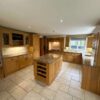 Large Bespoke Wooden Dovetail Joint Kitchen with Island and Utility Room – Neff Appliances – Black and Tan Fleck Granite Worktops