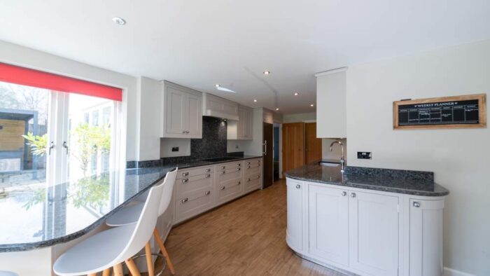 Luxury Bespoke Wooden Dovetail Joint Shaker Off White Kitchen + Peninsular – Miele Quooker appliances – Granite Worktops