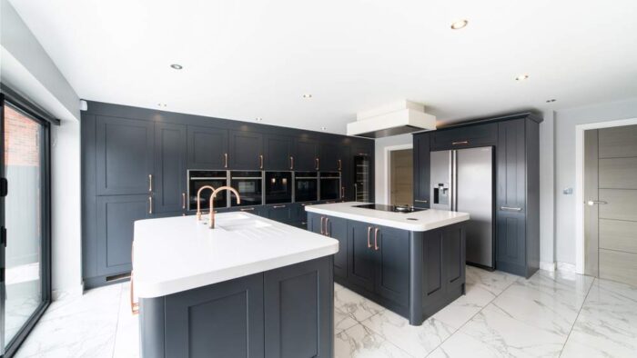 Luxury-Large-Panorama-Shaker-Blue-Kitchen-with-2-Large-Islands-and-Utility-Room-Copper-Handles-Tap-–-Neff-AEG-Quooker-Appliances-–-Corian-Stone-or-Acrylic-Worktops