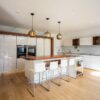 Luxury Poggenpohl Large Immaculate White Gloss Walnut Kitchen & Island – Siemens Appliances – Grey Quartz and Stainless Steel Worktops inc Walnut Breakfast Bar