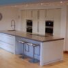 Pronorm Modern Buttermilk Gloss Kitchen & Large Matching Island – Miele Siemens Appliances – Corian Worktops