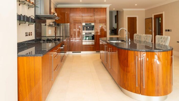 Bespoke Wooden Chrome Handled Kitchen with Large Matching Island & Dining Table including 8 Chairs - Miele Quooker Appliances – Granite Worktops