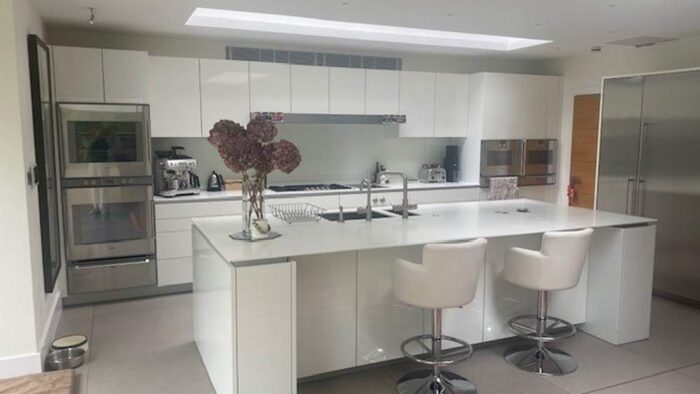 Large Luxury Poggenpohl Modern White Gloss Handless Kitchen & Large Island with Matching Utility Room – Gaggenau Miele Appliances – White Stone Worktops