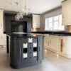 Laura Ashley Buttercream Wooden Dovetail Joint Symphony Kitchen with Graphite Grey Island and Utility Room – AEG Smeg Appliances – Black Granite Worktops